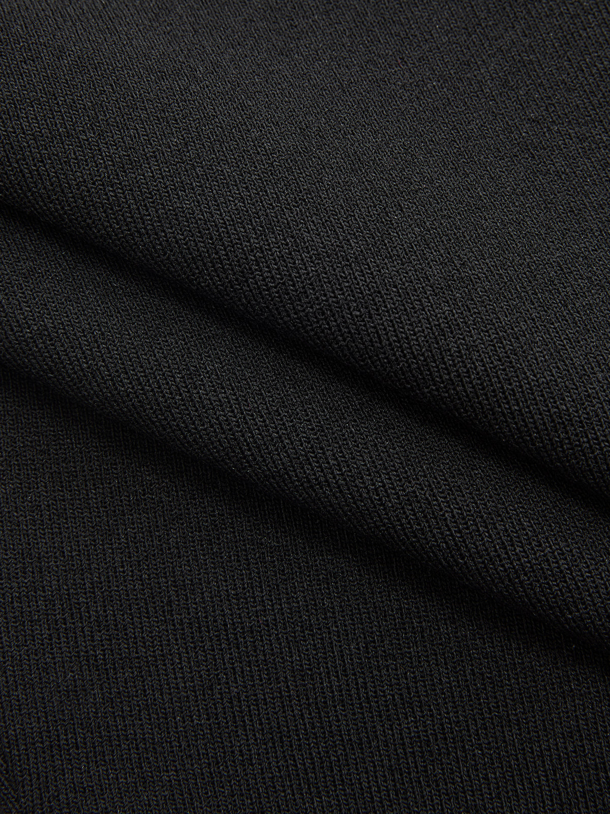 Black stretch-knit striped mock neck midi dress with diagonal ribbed texture and fine stitching.