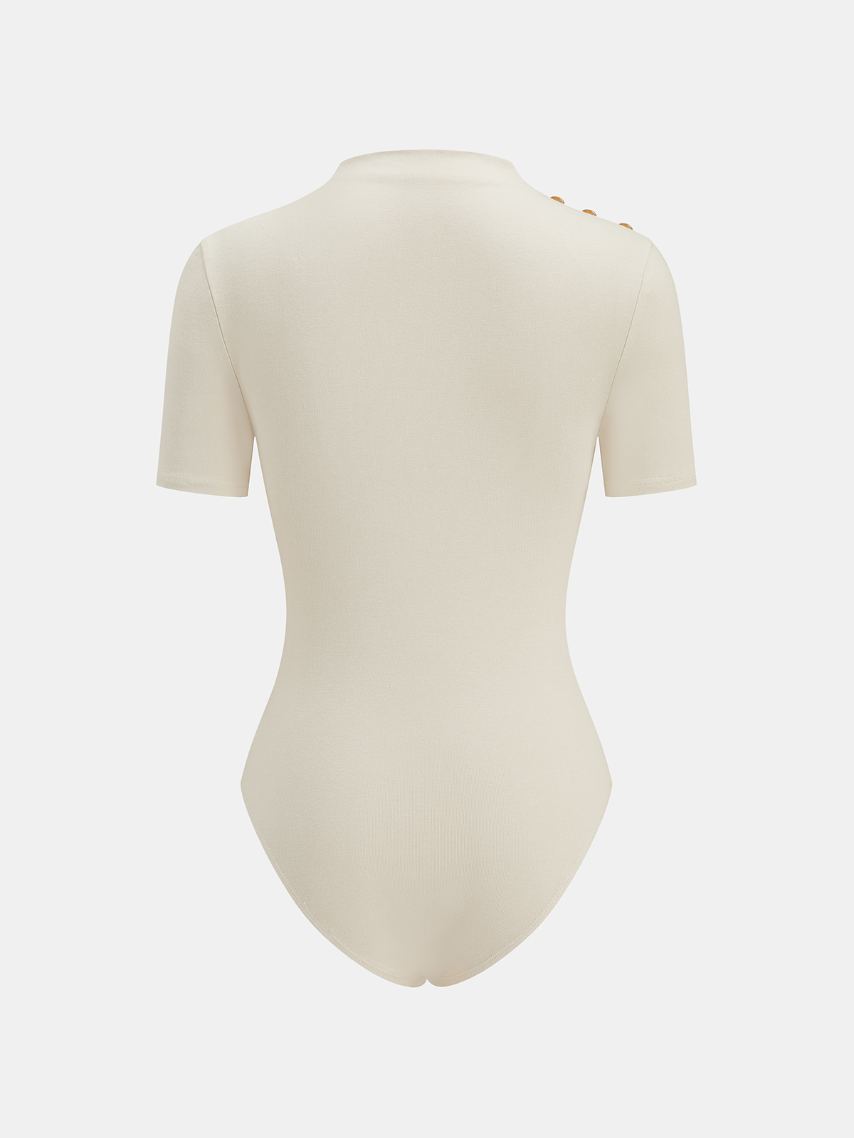 Cream ruched bodysuit with mock neck, metallic accents, short sleeves, and three gold shoulder buttons.