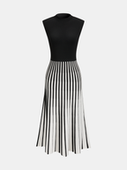 Fitted black bodice dress with flared striped skirt, mock neck, sleeveless, stretch-knit fabric.