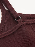 Burgundy knit camisole mini dress with umbrella hem, adjustable ring straps, ribbed fabric, visible stitching.