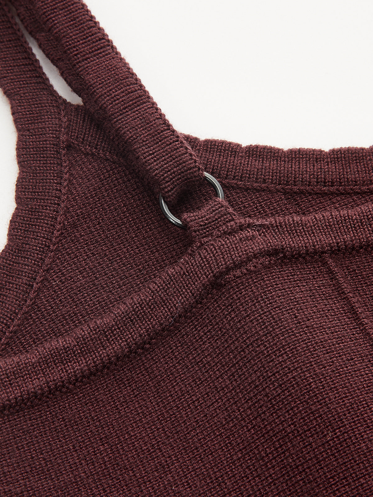 Burgundy knit camisole mini dress with umbrella hem, adjustable ring straps, ribbed fabric, visible stitching.