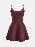Maroon knit camisole mini dress with high stretch, thin straps, fitted bodice, flared skirt.
