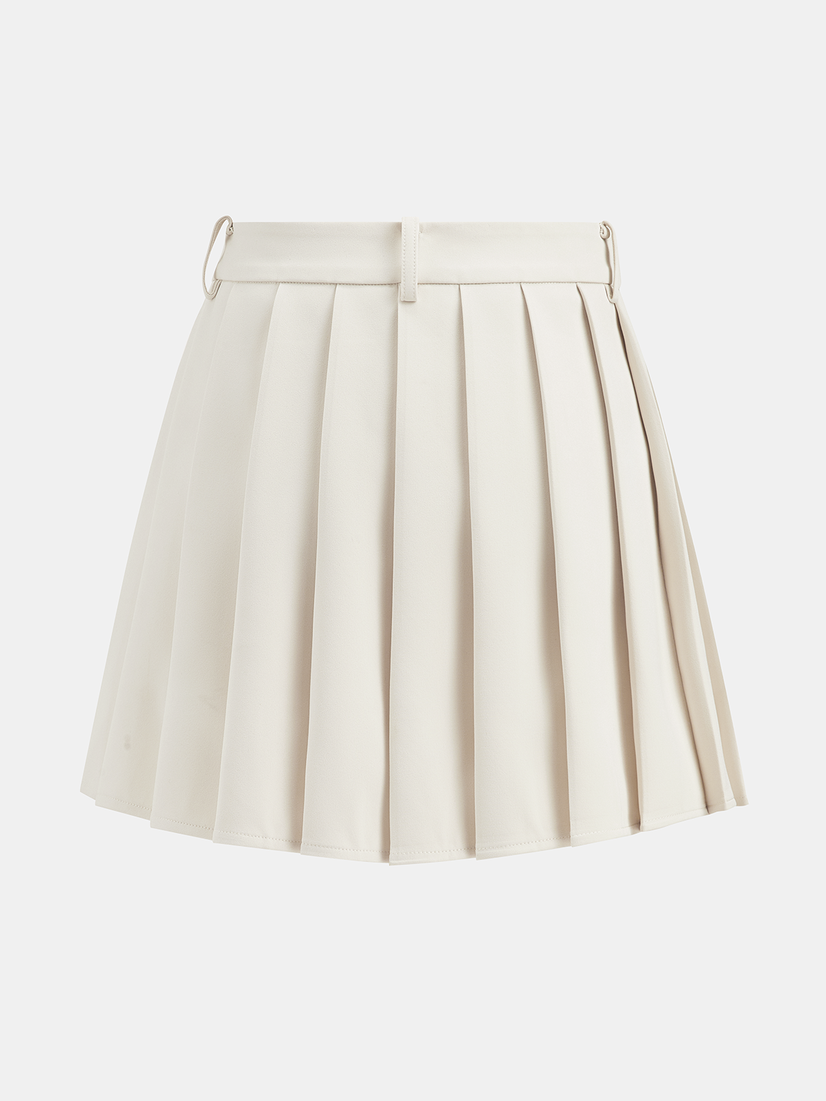 Cream belted vest paired with a pleated mini skirt featuring metal rings and loops.