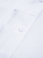 Semi-sheer long shirt with button-down ties, visible button, pocket edge, and neat stitching.