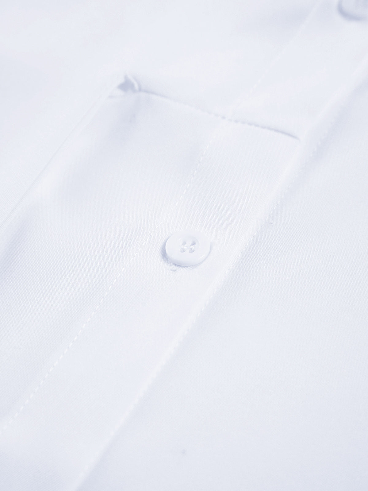 Semi-sheer long shirt with button-down ties, visible button, pocket edge, and neat stitching.