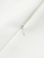 Silver zipper detail on smooth white LA FINE FLEUR pleated sleeveless mini dress.