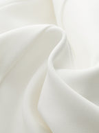 Smooth, flowing pleated mini dress with metal detail and elegant, chic slim-fit texture.