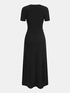 Short-sleeve dress with ruched sides, back buttons, fitted waist, and slight flared hem.