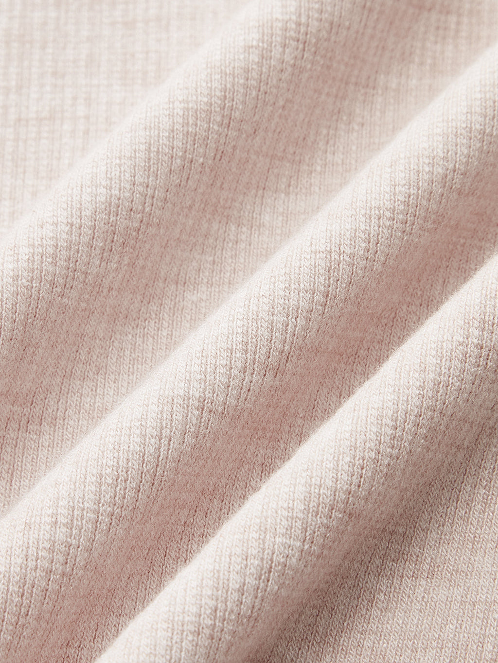 Light pink ribbed bodysuit with diagonal ruched folds, fine knit texture, and square neckline.
