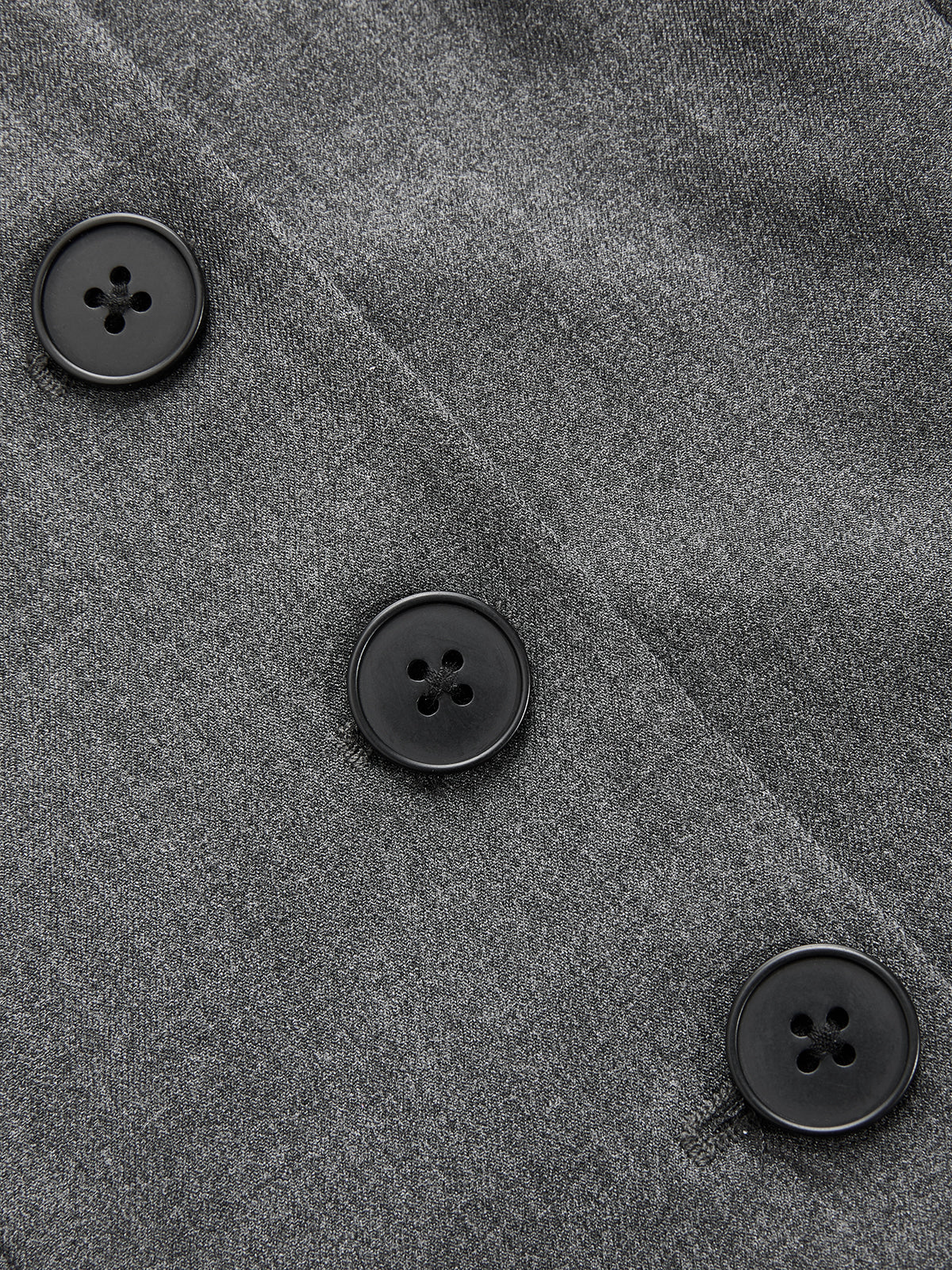 Sleeveless belted blazer dress with pleated details, gray fabric, and three black buttons.