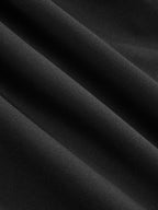 Black fabric dress with soft folds, subtle texture, button accents, and a flared hem.