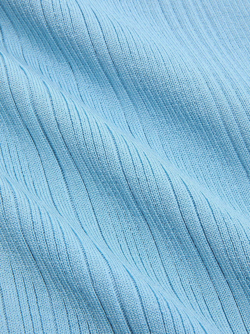 Light blue ribbed knit mini dress with diagonal texture, pearl trim, and ruffled hem.