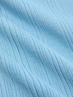 Light blue ribbed knit mini dress with diagonal texture, pearl trim, and ruffled hem.
