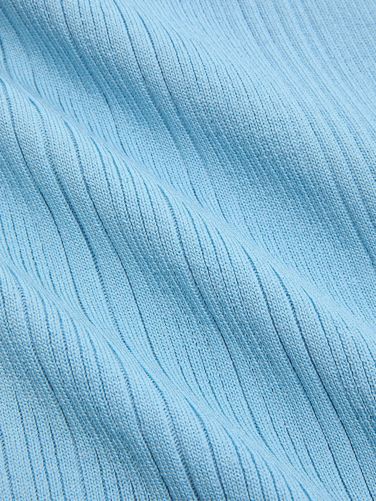 Light blue ribbed knit mini dress with diagonal texture, pearl trim, and ruffled hem.