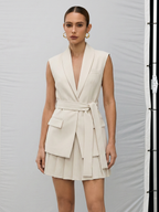 A belted vest paired with a pleated skirt from LA FINE FLEUR’s collection.