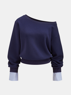 Off-shoulder navy blue sweatshirt with striped cuffs, ribbed waistband, and long sleeves.