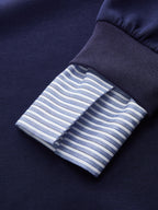 Navy blue cotton-rich off-shoulder sweatshirt with ribbed cuff and striped shirt cuff detail.