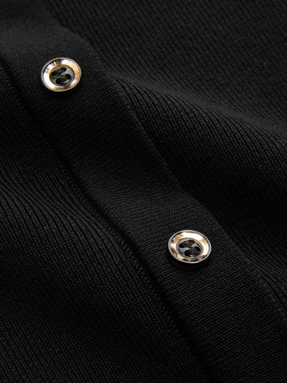 Black cap sleeve ribbed knit maxi dress with two silver buttons and visible stitching.