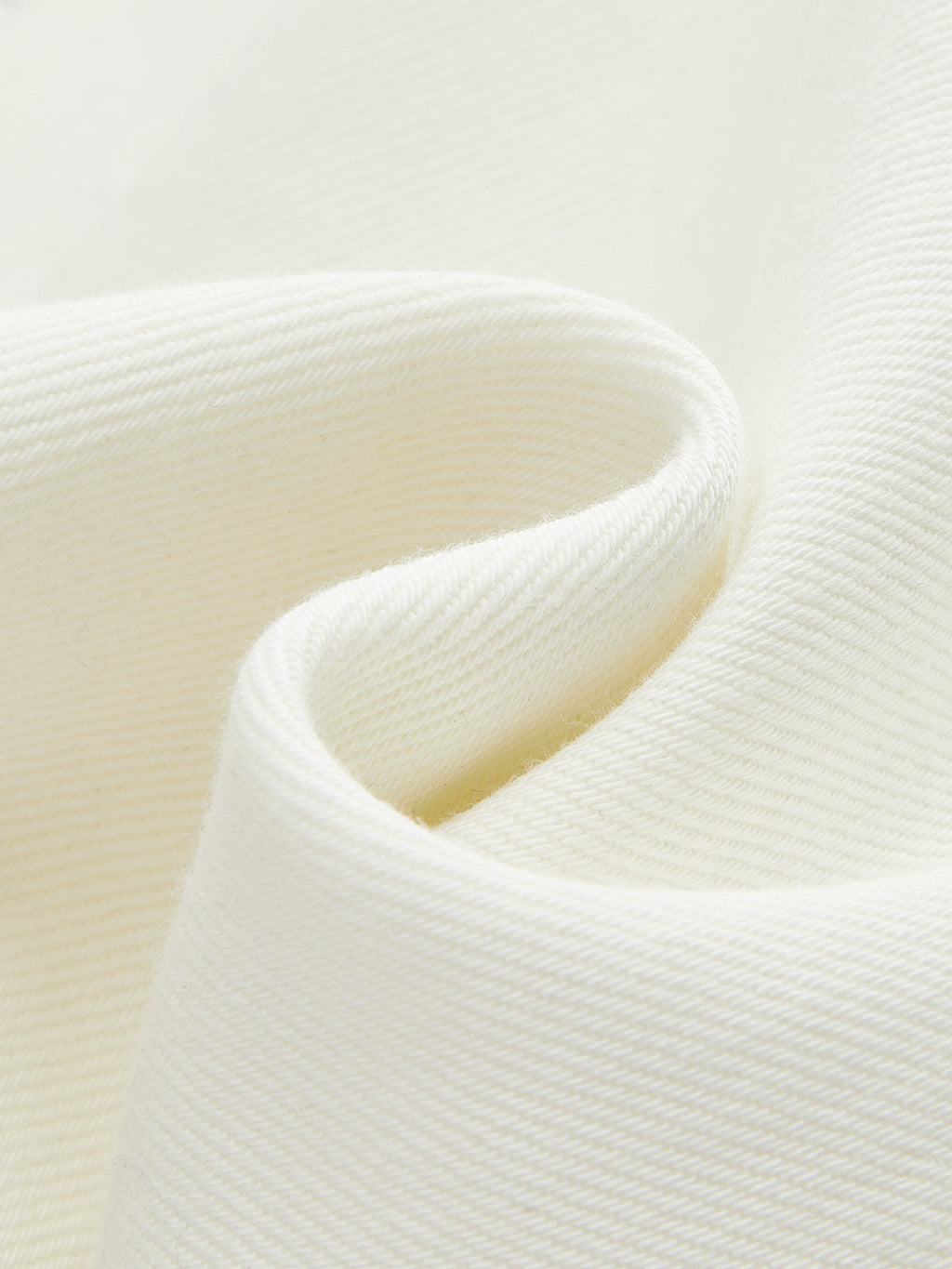 Off-white soft denim wide-leg jeans showcasing textured weave and gentle, natural fabric folds.