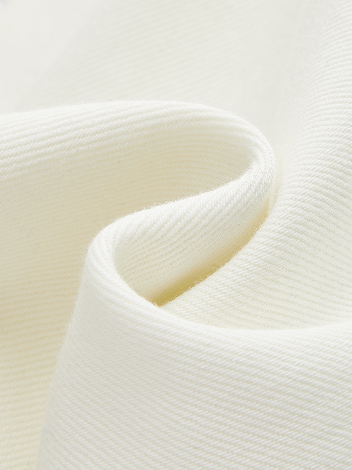 Off-white soft denim wide-leg jeans showcasing textured weave and gentle, natural fabric folds.