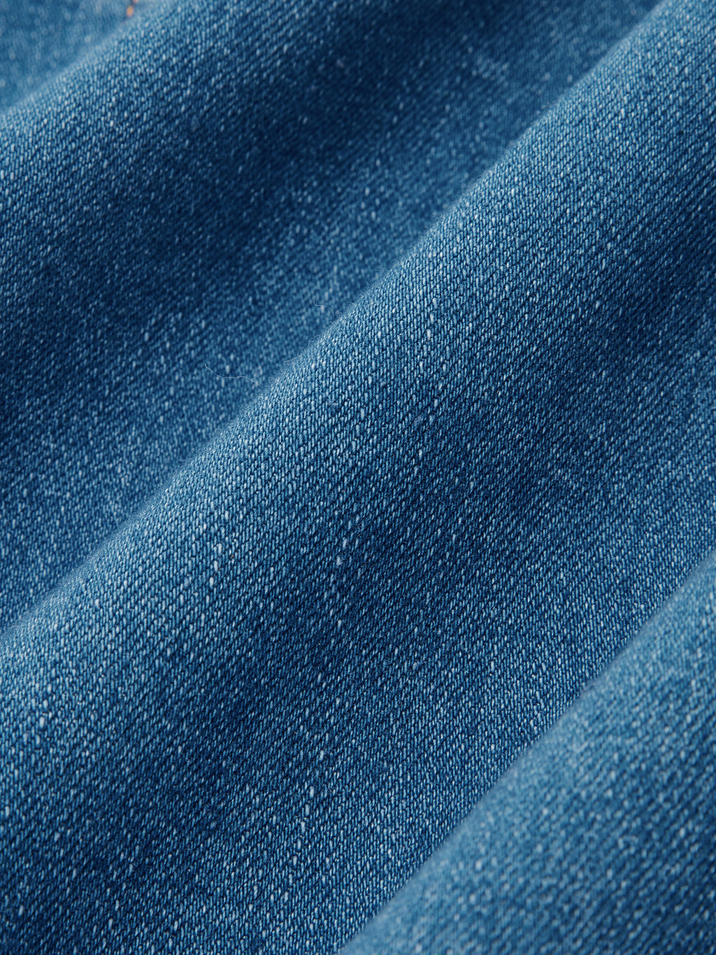 Blue denim halter dress with button-front and maxi design, detailed weave, soft shadows.