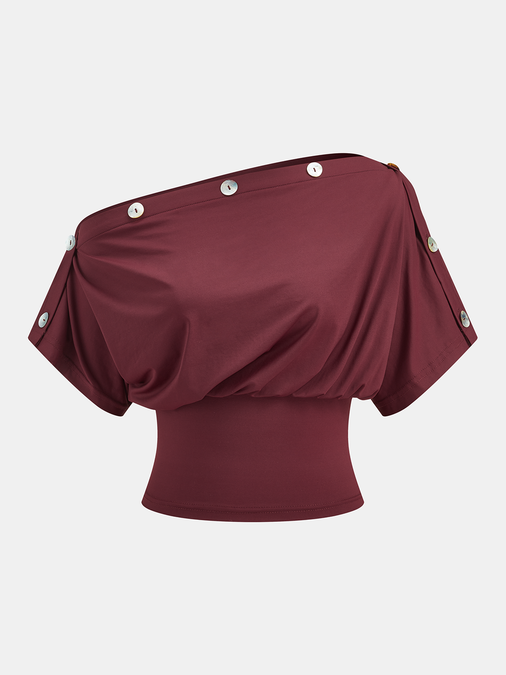 Chic maroon one-shoulder top with button details, fitted waistband, and relaxed drape.