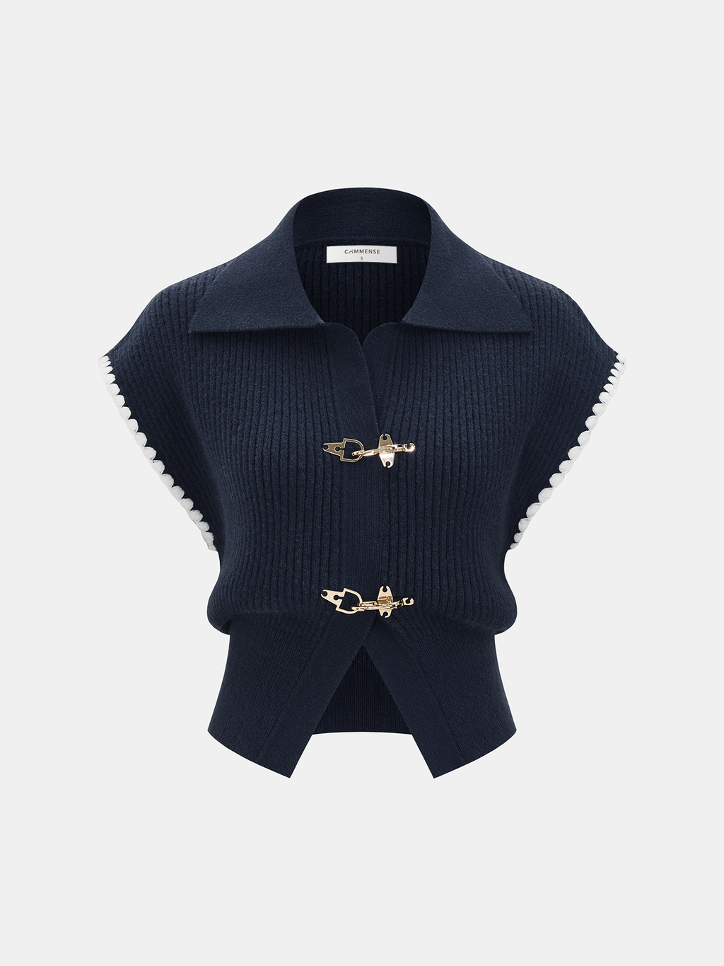 Navy blue sleeveless knit vest with collared neckline, white scalloped trim, and metal clasp.