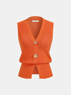 Sleeveless orange knit vest with V-neck, gold floral buttons, and a short center hem slit.