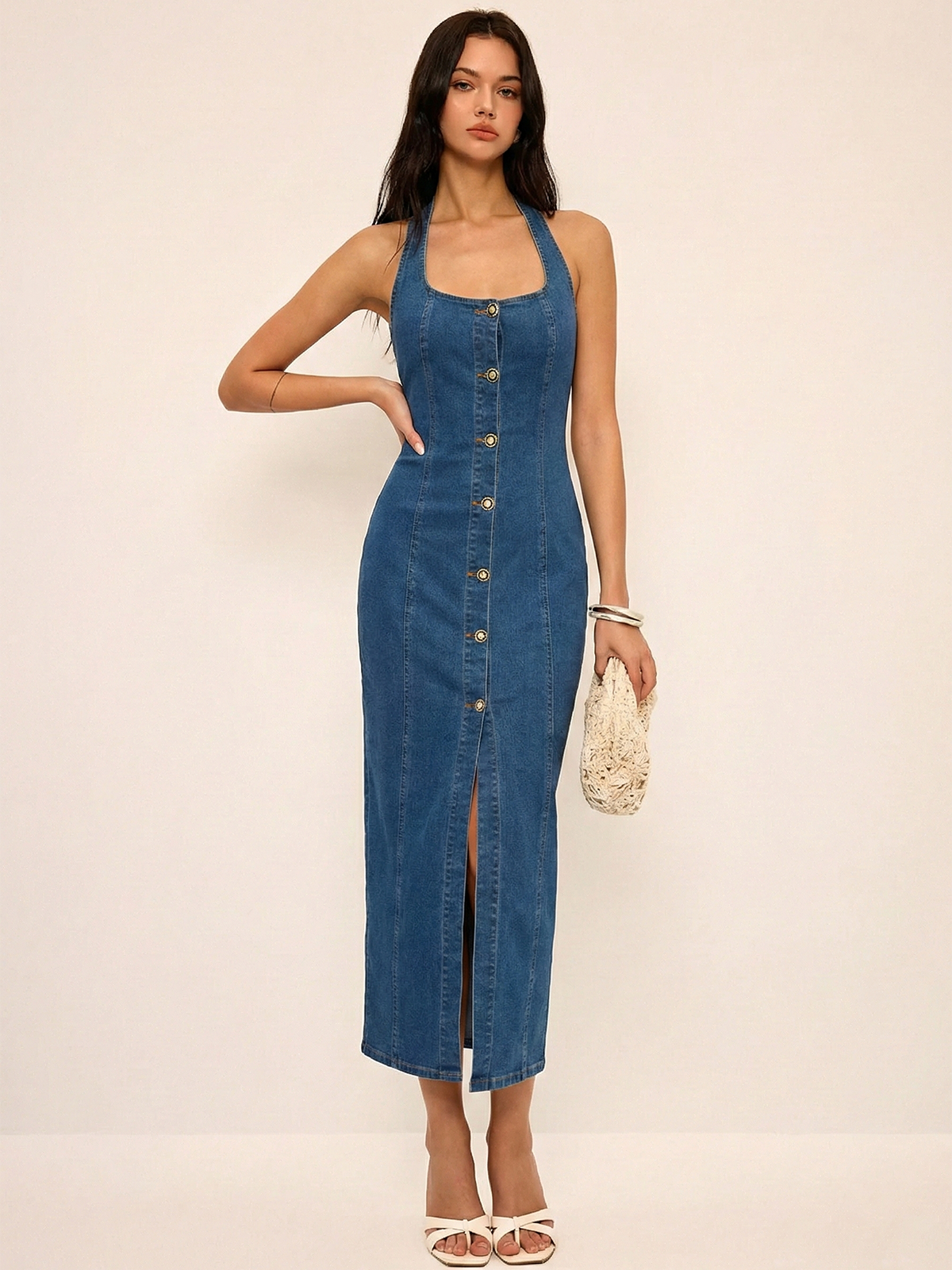 LA FINE FLEUR denim halter dress featuring a button-front maxi design.