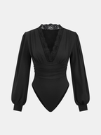 Lace-accented V-neck bodysuit with ruched detailing, puffed sleeves, and fitted cuffs.