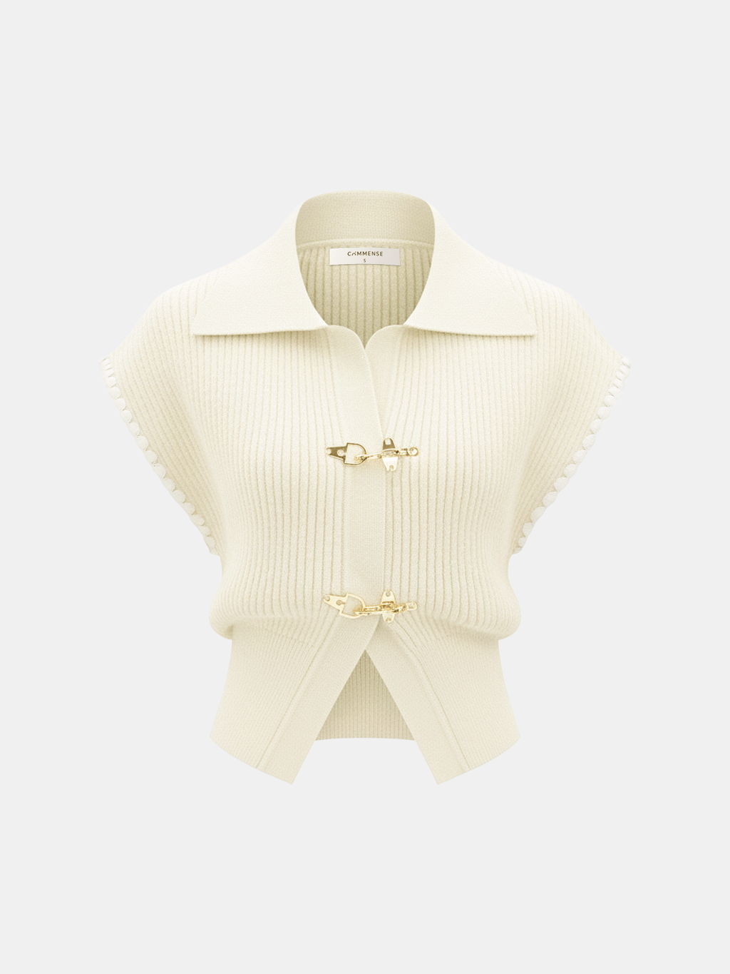 Cream knit vest with contrast trim, short sleeves, wide collar, and gold metal clasps.