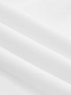 White cotton crop top with knotted sleeves, smooth jersey and soft diagonal folds.