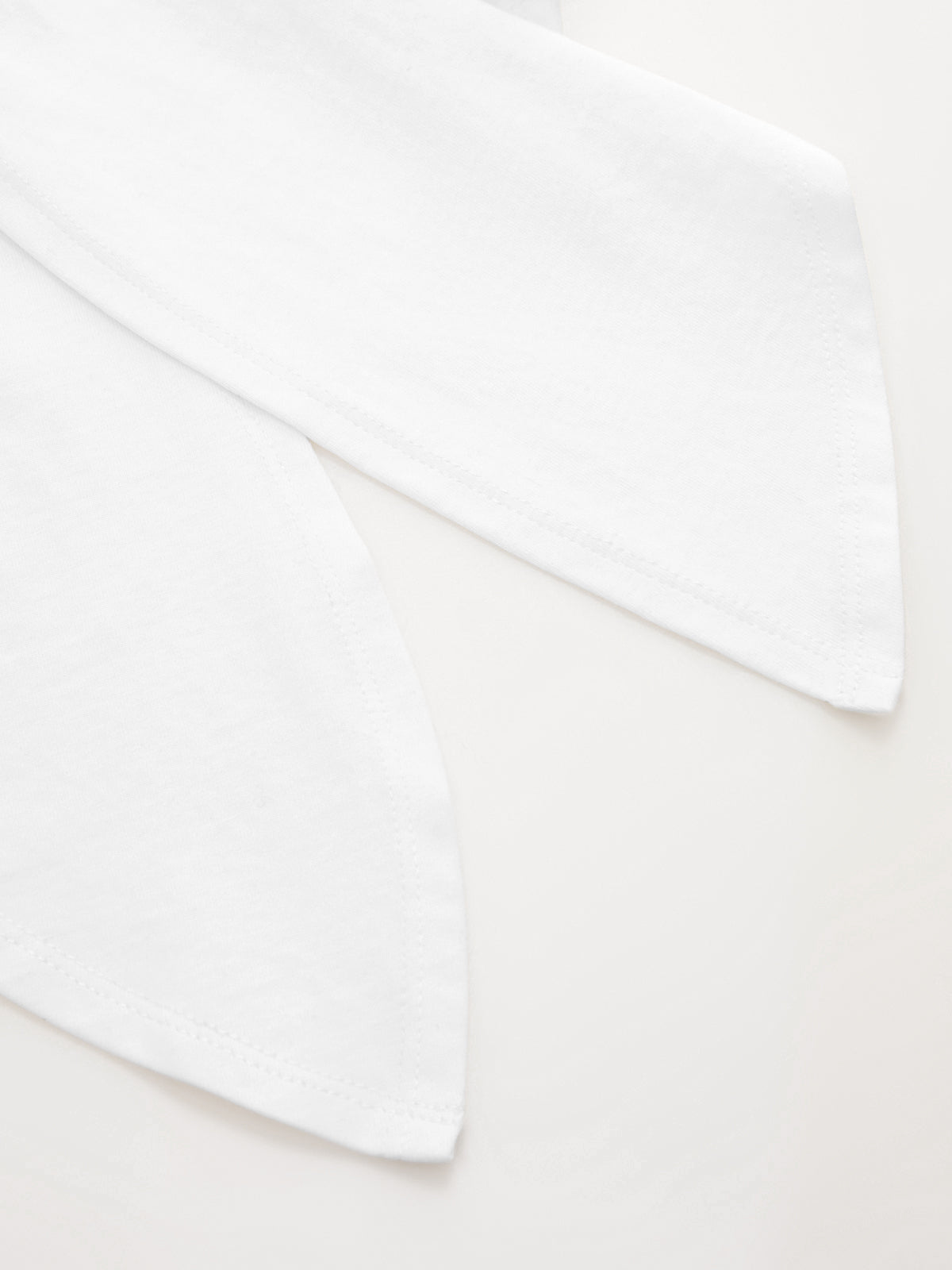 Two white cotton Knotted Sleeve Crop Tops with pointed ends, featuring a minimalist design.