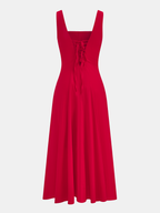 Cotton blend maxi dress with square neck, button-front closure, and a flowing midi skirt.