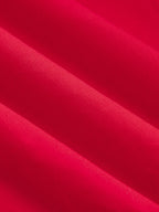 Close-up of a cotton blend maxi dress, bright red with button-front, soft folds, textured fabric.