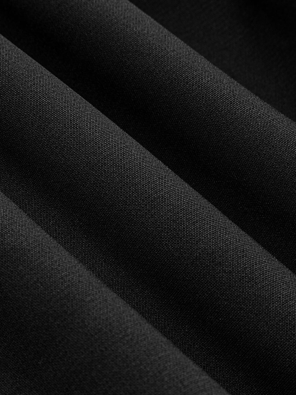 Close-up of the LA FINE FLEUR Mandarin Collar Dress, showing its textured black fabric folds.