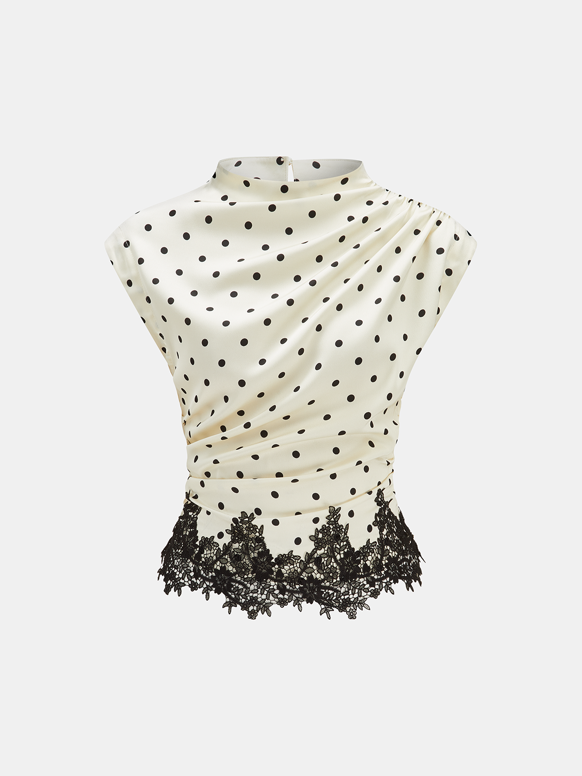 A sleeveless top with black polka dots, lace hem, and gentle ruching at the waist.
