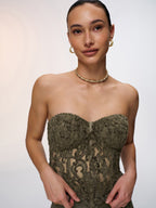 A strapless lace bustier top with a romantic design from LA FINE FLEUR.