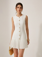 A sleeveless LA FINE FLEUR mini dress with metal detailing and pleated slim fit.