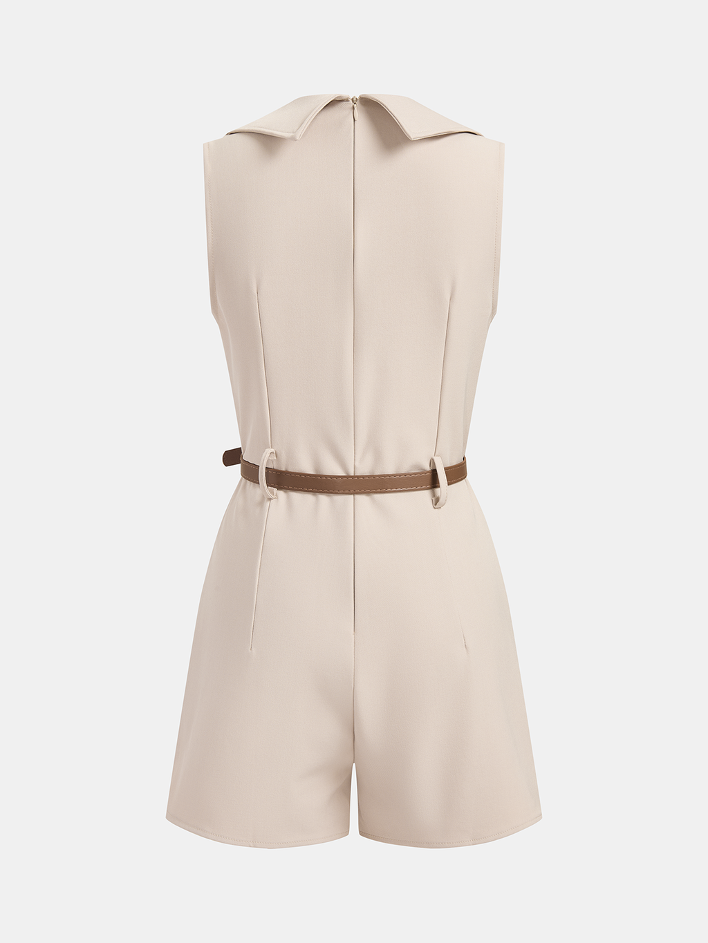 A beige sleeveless blazer romper with pointed collar, back zipper, brown waist belt, tailored shorts.