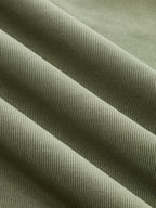 Olive green ribbed mock neck top with short sleeves, ruching, and diagonal textured ridges.