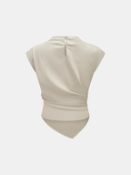 Sleeveless light beige satin blouse with draped ruched waist, asymmetrical hem, buttoned back.