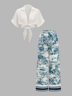 Knotted crop top and matching patterned pants set in blue and white toile print.