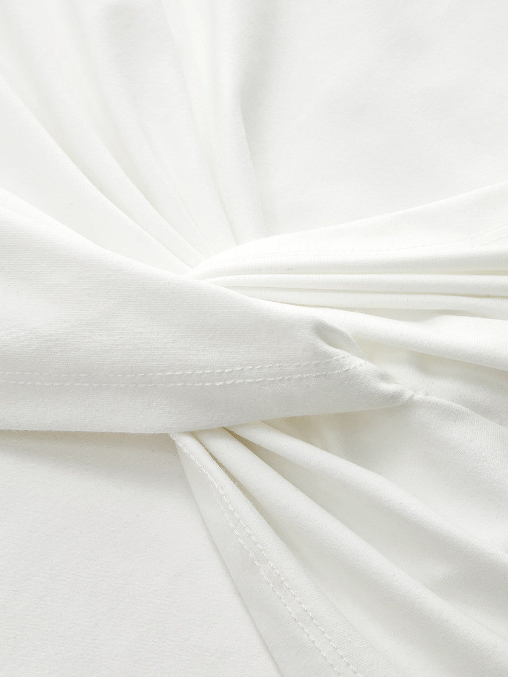 LA FINE FLEUR mock neck sleeveless top with ruched detail and visible edge stitching.
