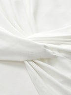 LA FINE FLEUR mock neck sleeveless top with ruched detail and visible edge stitching.