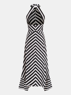 A black and white chevron striped halter maxi dress with a backless handkerchief hem.
