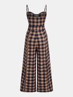 A plaid wide-leg jumpsuit with a belted cami top, tailored and sleeveless design.