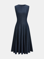 Sleeveless midi dress with a fitted bodice and flared, knee-length denim skirt.