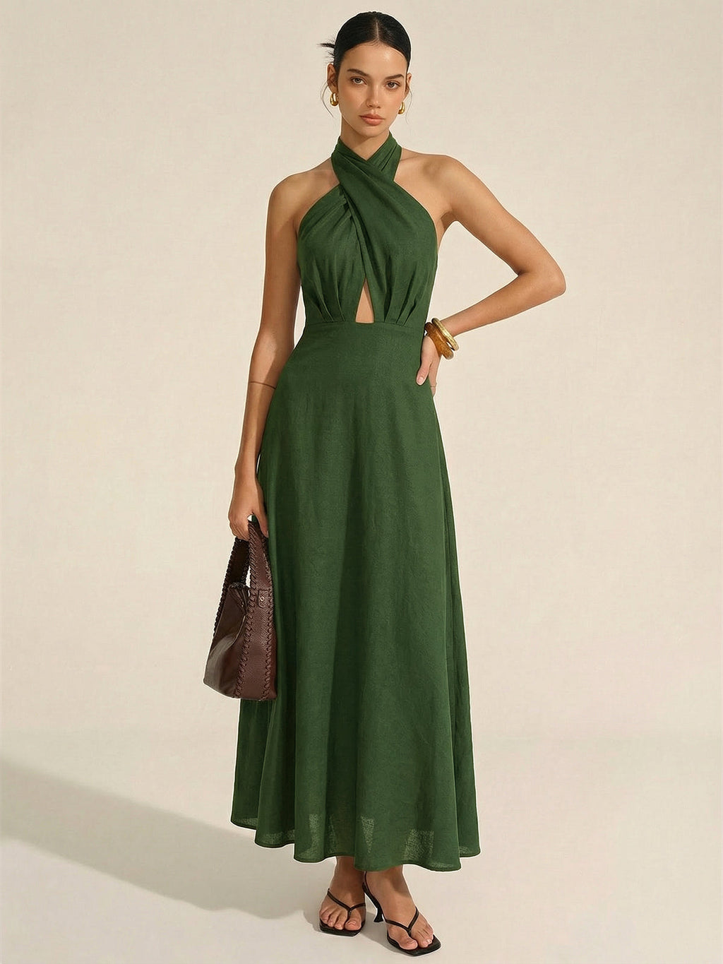Sleeveless dark green cotton linen maxi dress with halter neck cut-out, floor-length style.