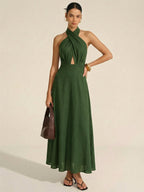 Sleeveless dark green cotton linen maxi dress with halter neck cut-out, floor-length style.